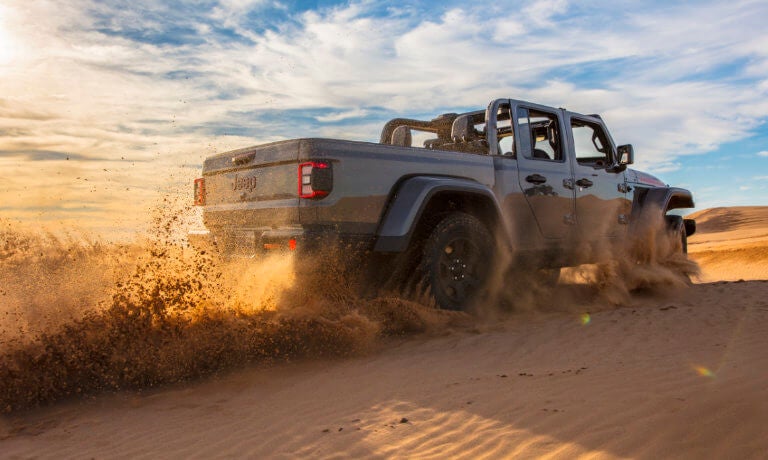 2022 Jeep Gladiator driving in the sand