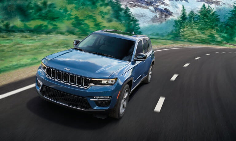 2024 Jeep Grand Cherokee driving on curved highway