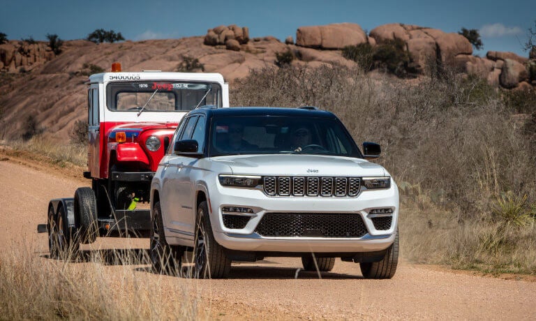 2024 Jeep Grand Cherokee 4xe towing a vehicle