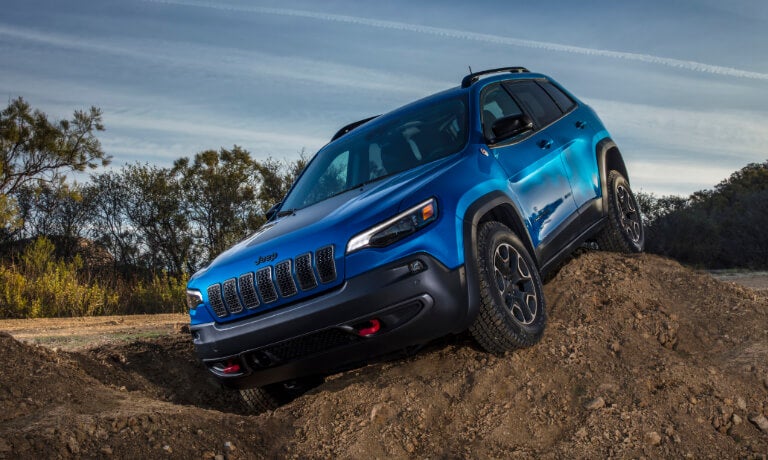 2023 Jeep Cherokee offroading on a dirt pile