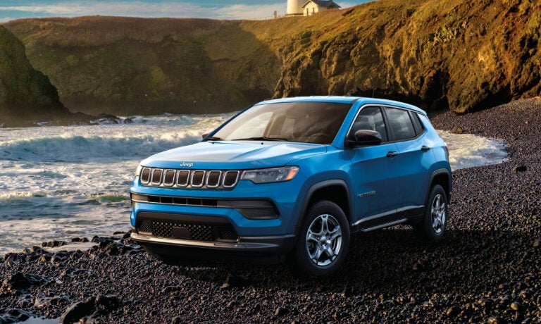 2023 Jeep Compass parked on a rocky beach