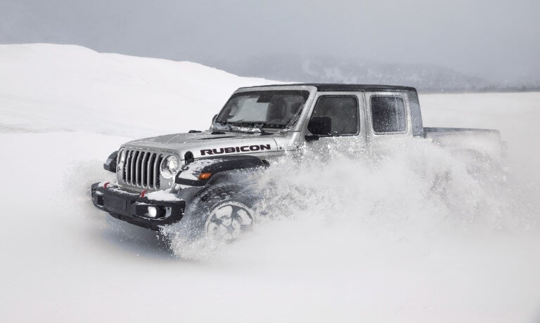 2023 Jeep Gladiator driving in deep snow