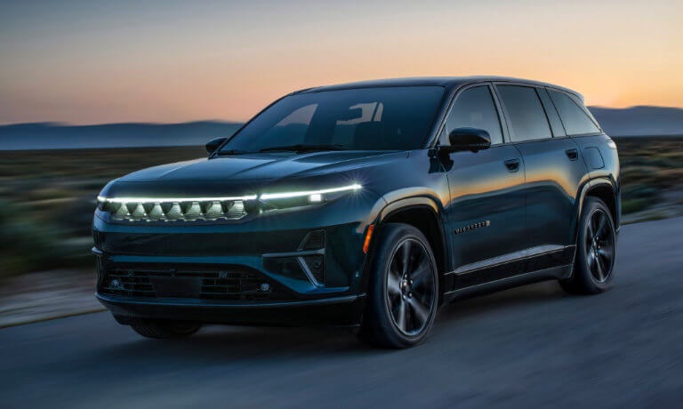 2024 Wagoneer S driving on highway at dusk