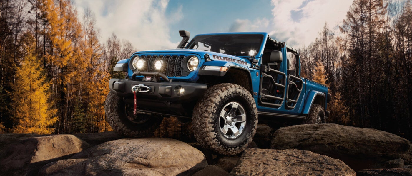 2025 Jeep Gladiator offroading on some rocks