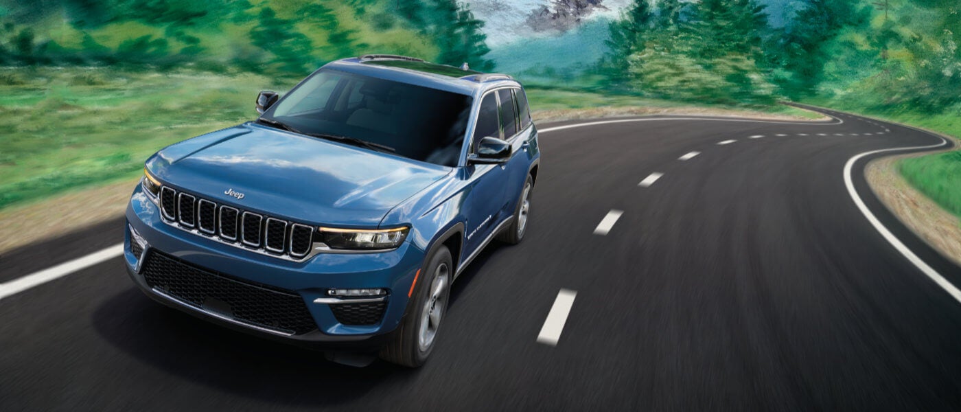 2025 Jeep Grand Cherokee driving fast on a highway