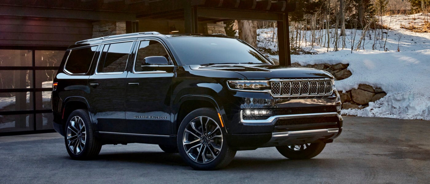 2025 Jeep Grand Wagoneer parked on snowy driveway